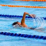a woman swimming laps in a pool, the bext exercise when you have fibroids