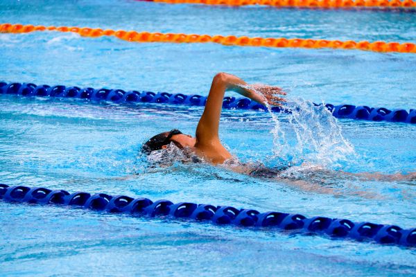 a woman swimming laps in a pool, the bext exercise when you have fibroids