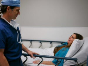 Dr. Carlson talking with patient before treatment