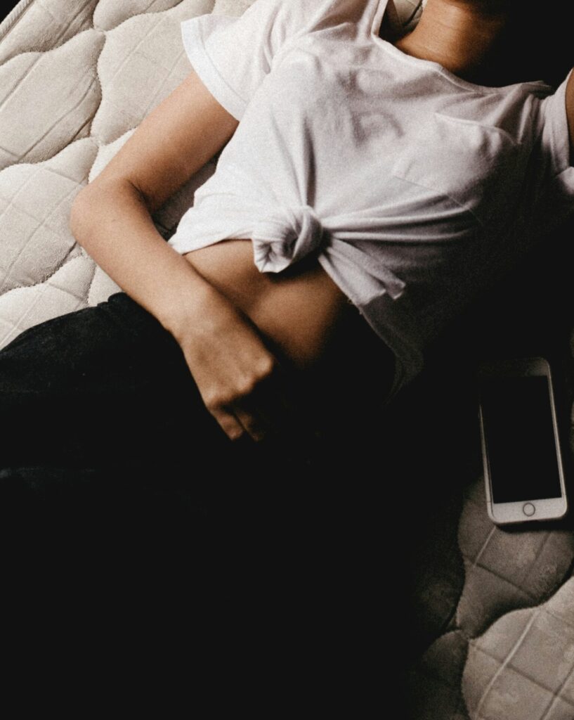 woman clutching stomach 