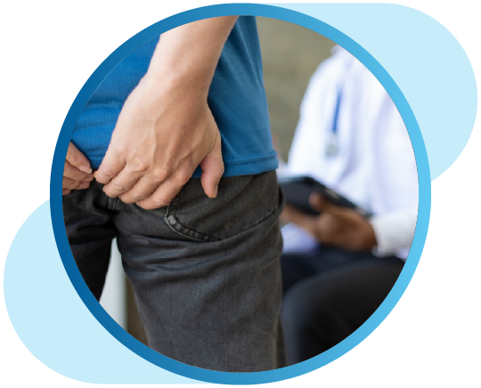 Person holding backside in pain