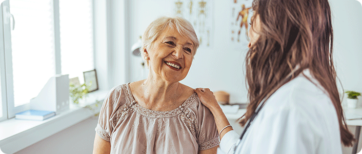 Woman smiling with doctor
