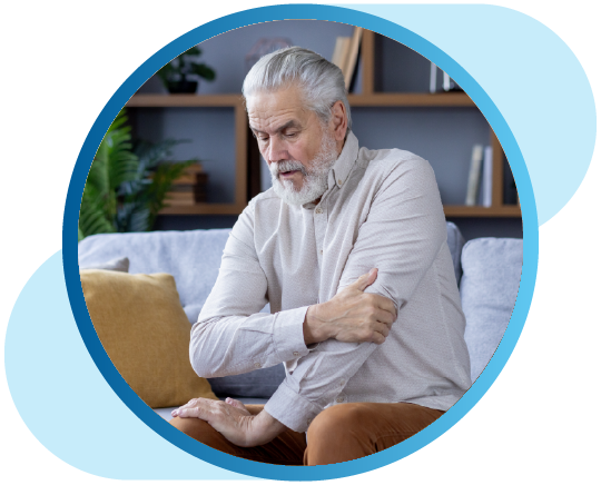 Man holding arm in pain