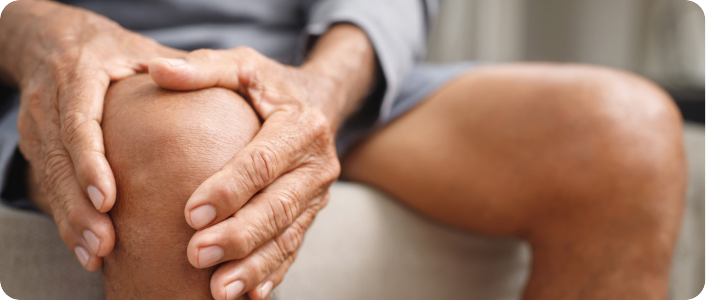 man holding his knee