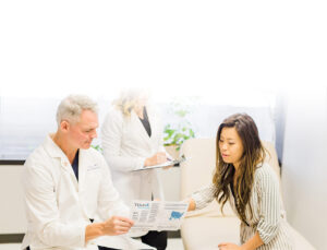 Doctor looking at information with patient